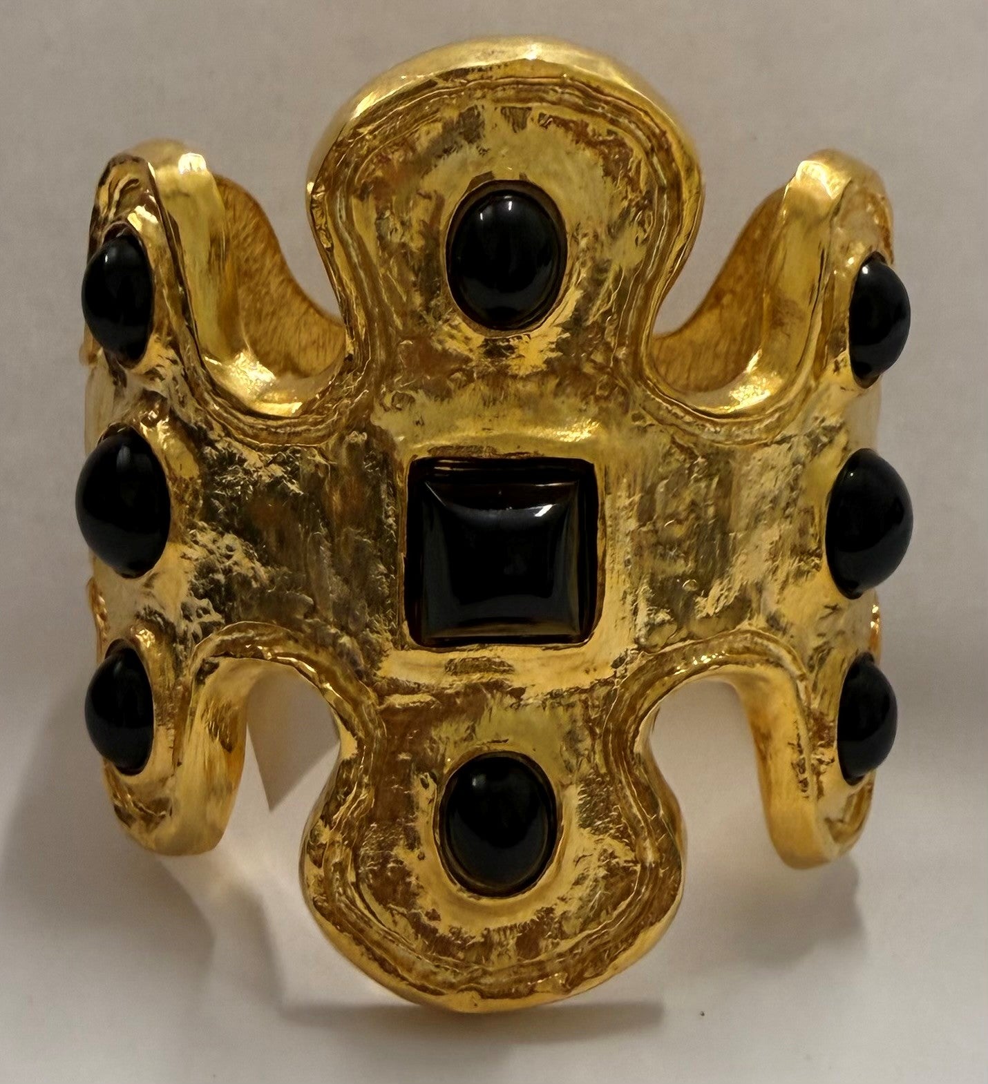 free form cuff with black cabochons